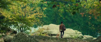 Movie still from “All the Bright Places” (2020), directed by Brett Haley – A man and a child are standing by the water; Extreme Wide shot, High angle