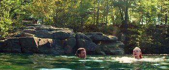 Movie still from “All the Bright Places” (2020), directed by Brett Haley – A man swimming in a body of water; Extreme Wide shot, High angle