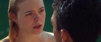 Movie still from “All the Bright Places” (2020), directed by Brett Haley – A man and a woman talking in the rain; Close Up shot, Over the shoulder angle