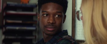 Movie still from “All the Bright Places” (2020), directed by Brett Haley – A person wearing a plaid shirt; Close Up shot, Over the shoulder angle