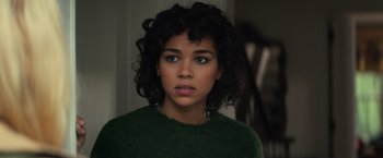 Movie still from “All the Bright Places” (2020), directed by Brett Haley – A person wearing a green sweater; Close Up shot, Over the shoulder angle