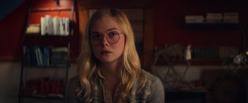 Movie still from “All the Bright Places” (2020), directed by Brett Haley – A woman with glasses is looking at the camera; Close Up shot, Over the shoulder angle