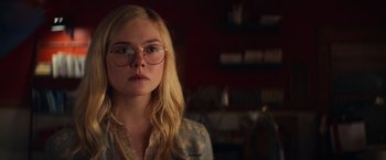 Movie still from “All the Bright Places” (2020), directed by Brett Haley – A woman wearing glasses looking at the camera; Close Up shot, Over the shoulder angle