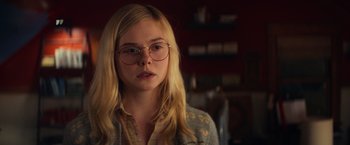 Movie still from “All the Bright Places” (2020), directed by Brett Haley – A woman with glasses is standing in a room; Close Up shot, Over the shoulder angle
