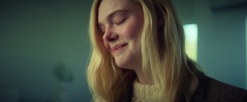 Movie still from “All the Bright Places” (2020), directed by Brett Haley – A young blonde woman with her eyes closed; Close Up shot, Low angle