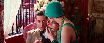 Movie still from “The Great Gatsby” (2013), directed by Baz Luhrmann – A man and a woman are looking at each other; Close Up shot, Over the shoulder angle