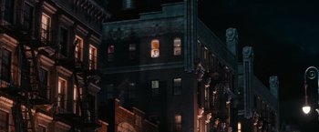 Movie still from “The Great Gatsby” (2013), directed by Baz Luhrmann – A view of a building at night from a window; Extreme Wide shot, High angle