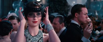 Movie still from “The Great Gatsby” (2013), directed by Baz Luhrmann – A person wearing a hat; Close Up shot, Over the shoulder angle