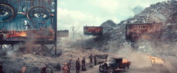 Movie still from “The Great Gatsby” (2013), directed by Baz Luhrmann – A group of men standing next to each other on top of a pile of rubble; Extreme Wide shot, High angle