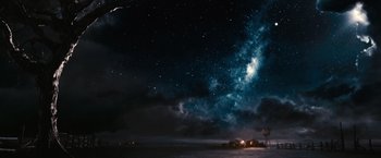 Movie still from “The Great Gatsby” (2013), directed by Baz Luhrmann – A night sky filled with stars and a lot of clouds; Extreme Wide shot, Low angle