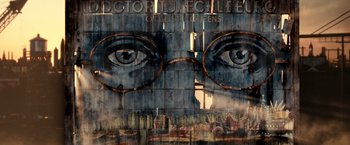 Movie still from “The Great Gatsby” (2013), directed by Baz Luhrmann – A mural of a pair of glasses on the side of a building; Extreme Close Up shot, Low angle
