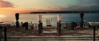 Movie still from “The Great Gatsby” (2013), directed by Baz Luhrmann – A view of a body of water and a pier; Extreme Wide shot, High angle