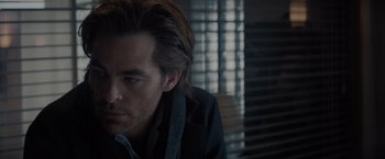 Movie still from “All the Old Knives” (2022), directed by Janus Metz – A person with long hair; Close Up shot, Over the shoulder angle