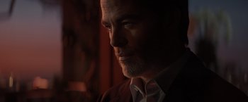 Movie still from “All the Old Knives” (2022), directed by Janus Metz – A person wearing a shirt and tie; Close Up shot, Low angle