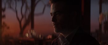 Movie still from “All the Old Knives” (2022), directed by Janus Metz – A person looking at the camera; Close Up shot, Low angle