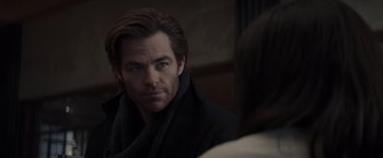 Movie still from “All the Old Knives” (2022), directed by Janus Metz – A person wearing a jacket; Close Up shot, Over the shoulder angle