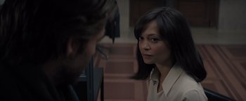 Movie still from “All the Old Knives” (2022), directed by Janus Metz – A woman looking at another woman in front of a door; Close Up shot, Over the shoulder angle