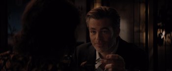 Movie still from “All the Old Knives” (2022), directed by Janus Metz – A person wearing a suit and tie; Close Up shot, Over the shoulder angle