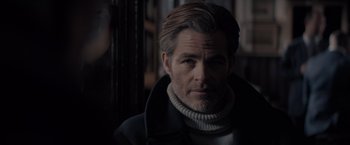 Movie still from “All the Old Knives” (2022), directed by Janus Metz – A person wearing a jacket; Close Up shot, Over the shoulder angle