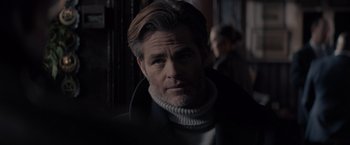 Movie still from “All the Old Knives” (2022), directed by Janus Metz – A person wearing a sweater; Close Up shot, Over the shoulder angle