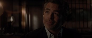 Movie still from “All the Old Knives” (2022), directed by Janus Metz – A person wearing a suit and tie; Close Up shot, Over the shoulder angle