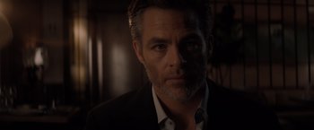 Movie still from “All the Old Knives” (2022), directed by Janus Metz – A person wearing a suit and tie; Close Up shot, Low angle