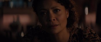 Movie still from “All the Old Knives” (2022), directed by Janus Metz – A woman's face in the dark; Close Up shot, Low angle