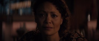 Movie still from “All the Old Knives” (2022), directed by Janus Metz – A person with a sad look on their face; Close Up shot, High angle