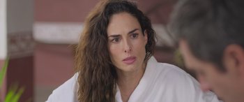 Movie still from “All the Places” (2023), directed by Pitipol Ybarra – A person with long hair; Close Up shot, Over the shoulder angle