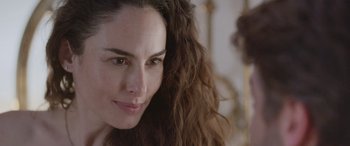 Movie still from “All the Places” (2023), directed by Pitipol Ybarra – A person with long brown hair; Close Up shot, Over the shoulder angle