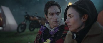 Movie still from “All the Places” (2023), directed by Pitipol Ybarra – A person wearing a sweater; Close Up shot, Over the shoulder angle