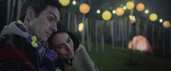 Movie still from “All the Places” (2023), directed by Pitipol Ybarra – A man and a woman standing next to each other; Close Up shot, Over the shoulder angle