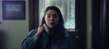 Movie still from “All Together Now” (2020), directed by Brett Haley – A woman with long black hair wearing a blue jacket; Close Up shot, Low angle