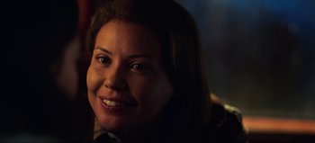Movie still from “All Together Now” (2020), directed by Brett Haley – A person smiling for the camera; Close Up shot, Over the shoulder angle