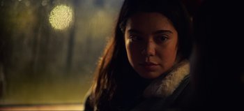 Movie still from “All Together Now” (2020), directed by Brett Haley – A young woman is looking into the camera; Close Up shot, Over the shoulder angle