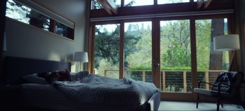 Movie still from “All Together Now” (2020), directed by Brett Haley – A bed room with a bed and a window with a view; Wide shot, High angle