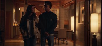 Movie still from “All Together Now” (2020), directed by Brett Haley – A man and a woman standing next to each other in a room; Medium shot, Over the shoulder angle