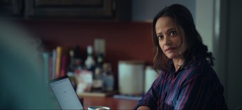 Movie still from “All Together Now” (2020), directed by Brett Haley – A woman sitting in front of a laptop computer; Close Up shot, Over the shoulder angle