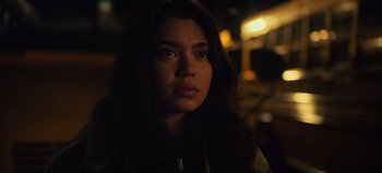 Movie still from “All Together Now” (2020), directed by Brett Haley – A woman with long dark brown hair stares into the camera; Close Up shot, Over the shoulder angle