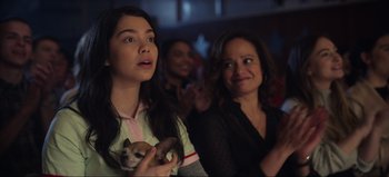 Movie still from “All Together Now” (2020), directed by Brett Haley – A woman holding a small dog in front of another woman; Close Up shot, Over the shoulder angle
