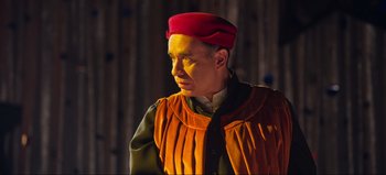 Movie still from “All Together Now” (2020), directed by Brett Haley – A man wearing a red hat and a yellow vest; Medium shot, Low angle