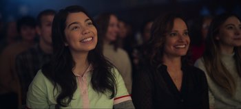 Movie still from “All Together Now” (2020), directed by Brett Haley – Two women smiling for the camera at a party; Close Up shot, Over the shoulder angle