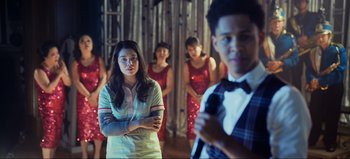 Movie still from “All Together Now” (2020), directed by Brett Haley – A group of people standing in front of a wall; Medium shot, Over the shoulder angle