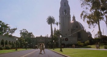 Movie still from “Almost Famous” (2000), directed by Cameron Crowe – Two people walking down the street in front of a church; Extreme Wide shot, High angle