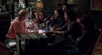 Movie still from “Almost Famous” (2000), directed by Cameron Crowe – A group of people sitting around a table; Medium shot, Over the shoulder angle