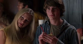 Movie still from “Almost Famous” (2000), directed by Cameron Crowe – A man and a woman sitting next to each other; Close Up shot, Low angle