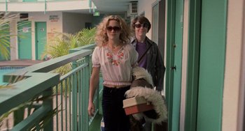 Movie still from “Almost Famous” (2000), directed by Cameron Crowe – A woman and a man walking down a balcony; Medium shot, Low angle