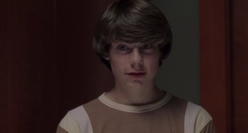 Movie still from “Almost Famous” (2000), directed by Cameron Crowe – A young man with short brown hair wearing a tan shirt; Close Up shot, Low angle