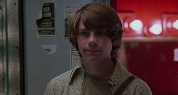 Movie still from “Almost Famous” (2000), directed by Cameron Crowe – A young man with long hair and a brown shirt; Close Up shot, Low angle