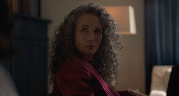 Movie still from “Along for the Ride” (2022), directed by Sofia Alvarez – A person with curly hair; Close Up shot, Over the shoulder angle